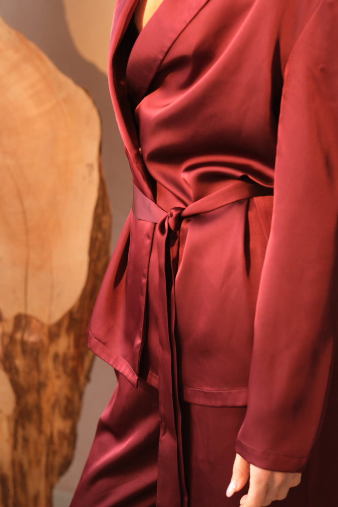 Burgundy brown satin suit close up belt detail tailoring
