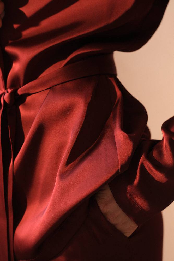 Burgundy brown satin fabric texture luxury tailoring detail